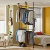 SoBuy Garderobe KLS03-SCH im Schlafzimmer mit Kleidung auf Hängern und Akzentwänden Náhled obrázku produktu