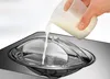 A person is pouring a liquid into an ice cream maker. Produktbild-Vorschau