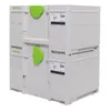 A stack of four white toolboxes with green latches, branded Festool. Podgląd zdjęcia produktu