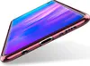 A close-up, angled view of a smartphone case with a rose gold metallic trim and a transparent body, showing the phone's screen with a colorful abstract wallpaper. Produktbild-Vorschau