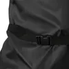 Close-up of a black fabric with a black strap and buckle. Produktbild-Vorschau