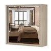 A mirrored wardrobe reflecting a bedroom interior. Voir les images du produit