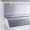 Close-up view of the interior of a white metal shoe cabinet, showing a shelf with a raised lip. Podgląd zdjęcia produktu