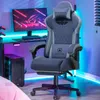 A gaming chair and desk setup in a room with colorful LED lighting. Produktbild-Vorschau