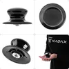 A collage of images showing a black pot lid handle from different angles, including a close-up of the handle being held by a person. Podgląd zdjęcia produktu