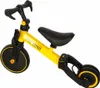 A yellow and black children's trike is shown against a white background. Podgląd zdjęcia produktu