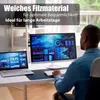 A person working at a desk with multiple computer screens displaying data. Produktbild-Vorschau