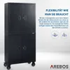 A black metal cabinet with two doors on top and two doors on the bottom, mounted on wheels. Text and icons are on the right side. Produktbild-Vorschau
