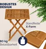 A wooden folding table is shown outdoors with greenery in the background and marketing text. Produktbild-Vorschau