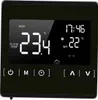 A close-up of a black digital thermostat with a bright LCD screen displaying temperature and time. Náhľad obrázku produktu