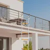 A rope ladder is attached to a balcony railing. Náhled obrázku produktu