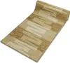 A rolled-up rug runner with a geometric pattern. Produktbild-Vorschau