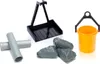 A collection of toy construction accessories, including pipes, rocks, a scoop, and a bucket, arranged on a white background. Náhľad obrázku produktu