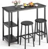 A bar table and two bar stools are set up with some decorative items on the table. Náhľad obrázku produktu