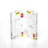 Two white boxes containing white earphones, displayed against a white background. Voir les images du produit