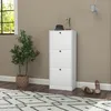 A white shoe cabinet with three drawers is shown in a room with a plant and a rug. Produktbild-Vorschau