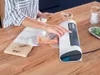 A person is using a vacuum sealer on a wooden table. Anteprima dell’immagine prodotto