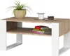 A modern coffee table with a wood-grain top and white legs, decorated with a plant, a cup, and a slice of cake. Voir les images du produit