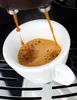Espresso being poured into a white cup. Produktbild-Vorschau