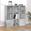 A concrete gray cube shelf unit with books and decorative items on display. Náhled obrázku produktu