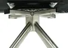 A close-up view of the base of a chair, showing the metal frame and swivel mechanism. Voir les images du produit