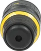 A close-up view of a black and yellow tool accessory, likely a drill chuck, with some text and directional arrows visible on the top surface. Produktbild-Vorschau