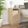 A bedside table next to a bed. Anteprima dell’immagine prodotto