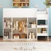 A white loft bed with a built-in closet and storage shelves, decorated with children's items and clothing. Podgląd zdjęcia produktu