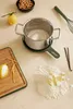 A kitchen counter with baking ingredients and utensils. Produktbild-Vorschau