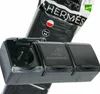 A black triple electrical socket with protective covers, shown in front of its packaging. Anteprima dell’immagine prodotto