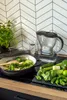 A water filter pitcher and fresh vegetables are arranged on a kitchen counter. Náhľad obrázku produktu
