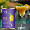 A can of mango pulp and a mango margarita are displayed on a table next to a pool. Náhľad obrázku produktu