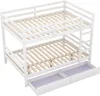 A white wooden bunk bed with two drawers underneath, shown from a slightly elevated diagonal angle against a white background. Náhled obrázku produktu