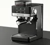 A black and silver espresso machine with a bean hopper on top, displayed on a dark surface against a light gray background. Náhled obrázku produktu
