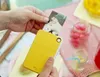 A person is holding a yellow instant camera and printing a photo. Náhled obrázku produktu