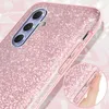 Close-up of a pink glitter phone case with a hand pressing the side buttons. Náhľad obrázku produktu