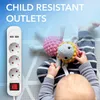 A child is playing with stuffed toys next to a power strip with USB ports. Produktbild-Vorschau