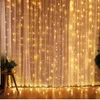 A curtain of warm white fairy lights hanging behind sheer curtains. Náhľad obrázku produktu