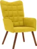 A yellow velvet armchair with wooden legs against a white background. Náhľad obrázku produktu