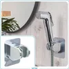 A bidet shower head and holder are shown, with a close-up inset of the holder. Náhľad obrázku produktu