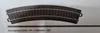 A close-up of a curved model train track piece. Produktbild-Vorschau