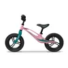 A pink balance bike with teal accents is shown against a white background. Produktbild-Vorschau
