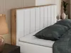 A close-up view of a bed with a white upholstered headboard and a wooden frame. Produktbild-Vorschau