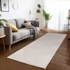 A living room scene with a sofa, rug, and plants. Podgląd zdjęcia produktu