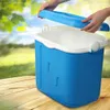 A blue cooler is on a wooden table outdoors, with a person's hands opening the lid. Podgląd zdjęcia produktu