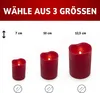 Three red LED candles of different sizes are displayed side-by-side, with their dimensions indicated above them. Produktbild-Vorschau