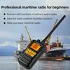A handheld maritime radio is shown in the foreground with large cargo ships and cranes in the background. Voir les images du produit