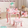 A pink and white kids vanity set with a mirror and stool, with dimensions indicated by dashed lines and measurements. Podgląd zdjęcia produktu
