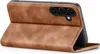 A brown flip cover case for a smartphone is shown standing upright, with the phone inside. Produktbild-Vorschau