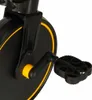 A close-up view of the pedal and crank arm of a black exercise bike with yellow accents. Podgląd zdjęcia produktu